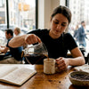 Barista preparing single-origin coffee tasting