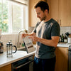 Man checking coffee bean roast date in kitchen