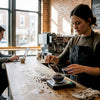 Barista blending two types of coffee beans