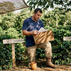 Auditor reviewing coffee farm certification paperwork