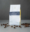 Three bags of House Coffee specialty beans (Gold, Diamond, and Limited Edition) on a white background.